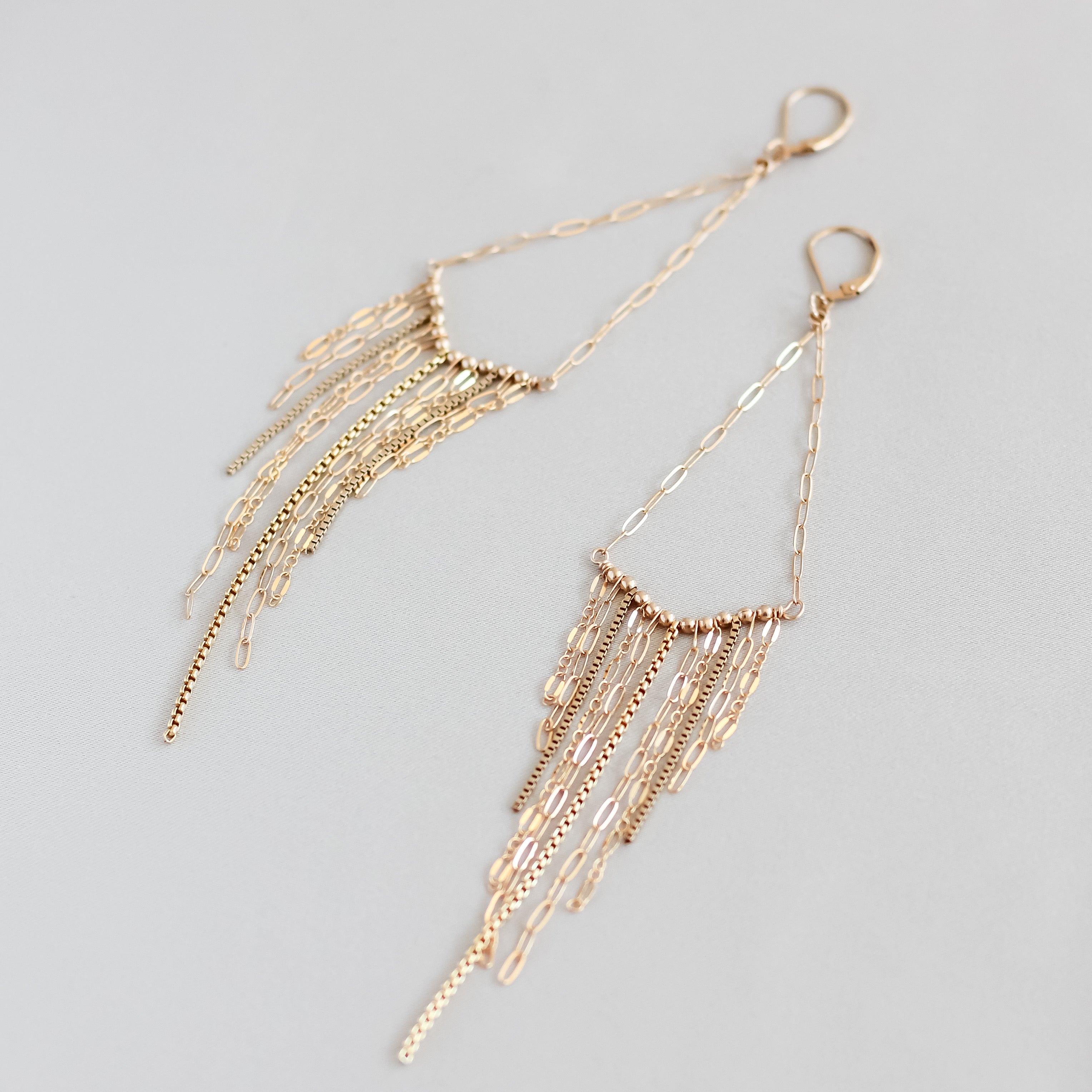 V fringe earrings